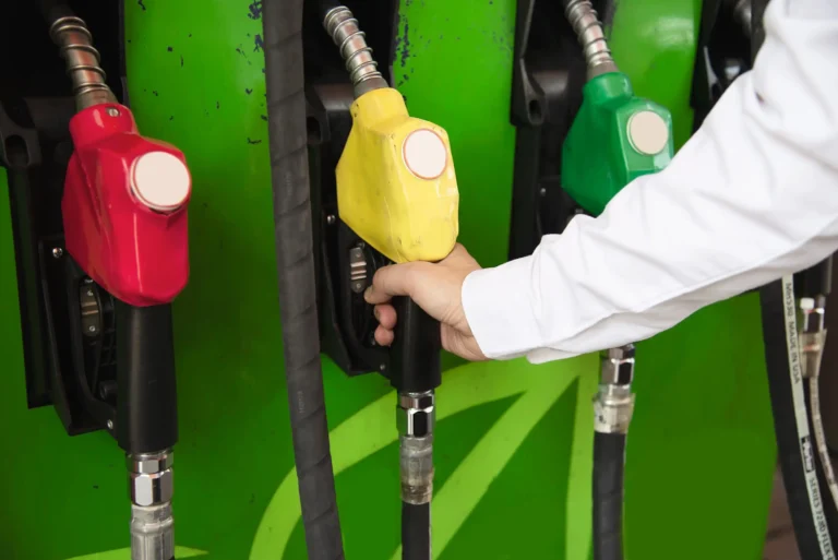 man-putting-gasoline-fuel-into-his-car-pump-gas-station (Web H)